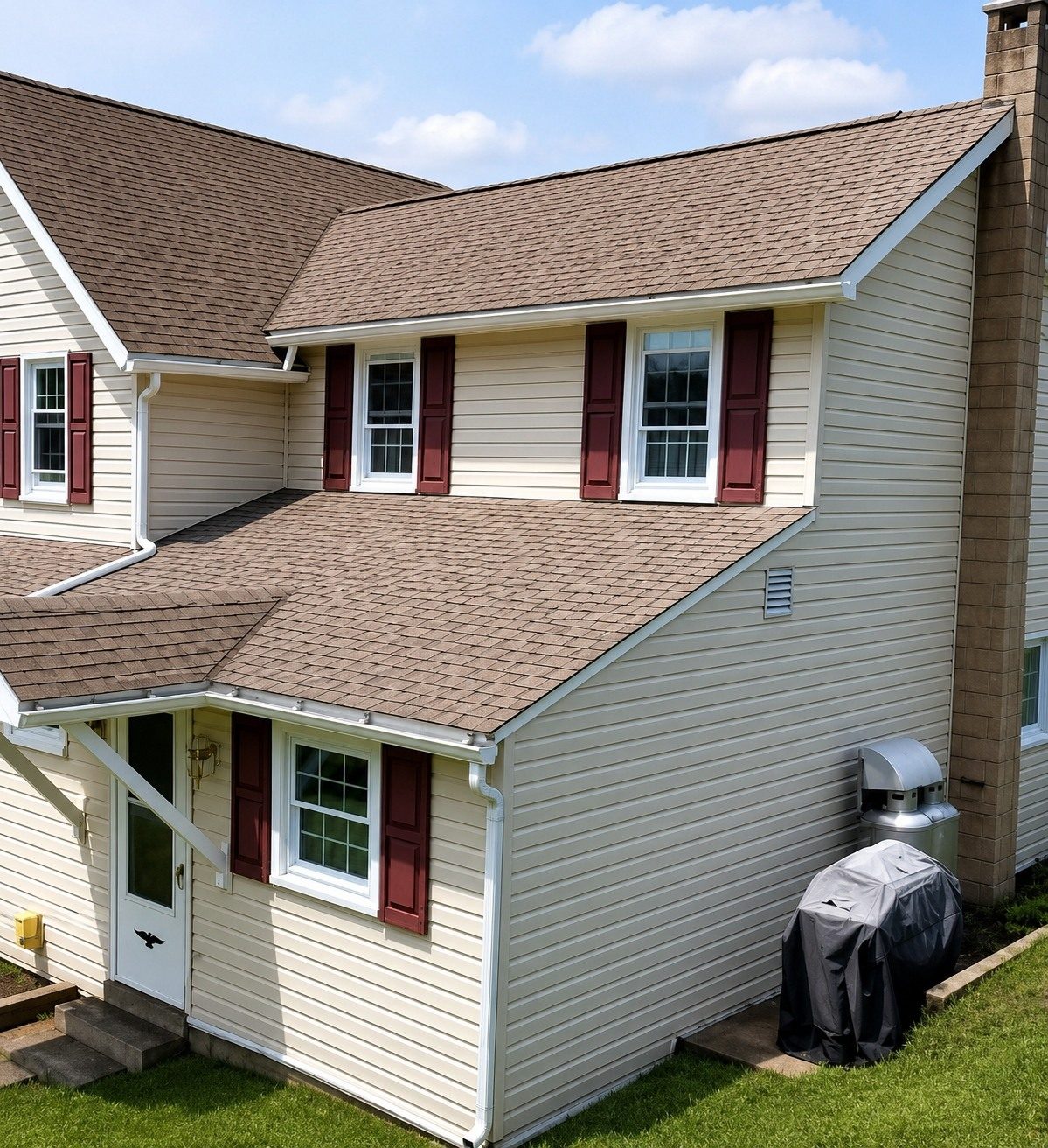 Same two-story home after soft-wash house cleaning — bright, clean siding
